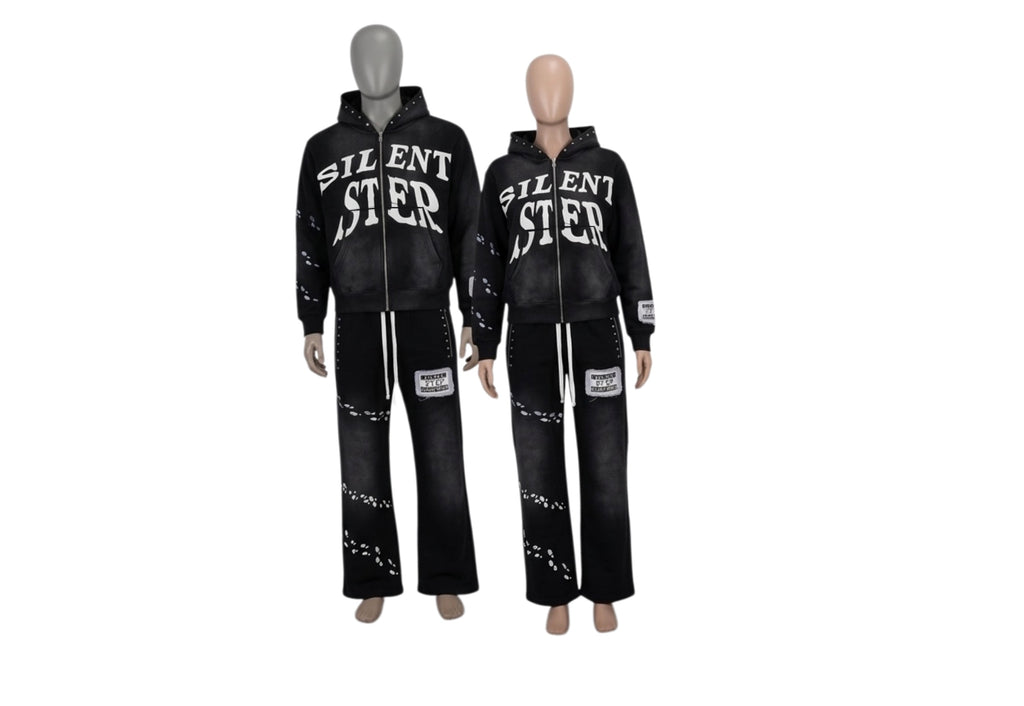 Two black hooded tracksuits displayed on mannequins, featuring the word 'SILENT STEP' in white across the chest and distressed white details on the pants, against a plain white background.