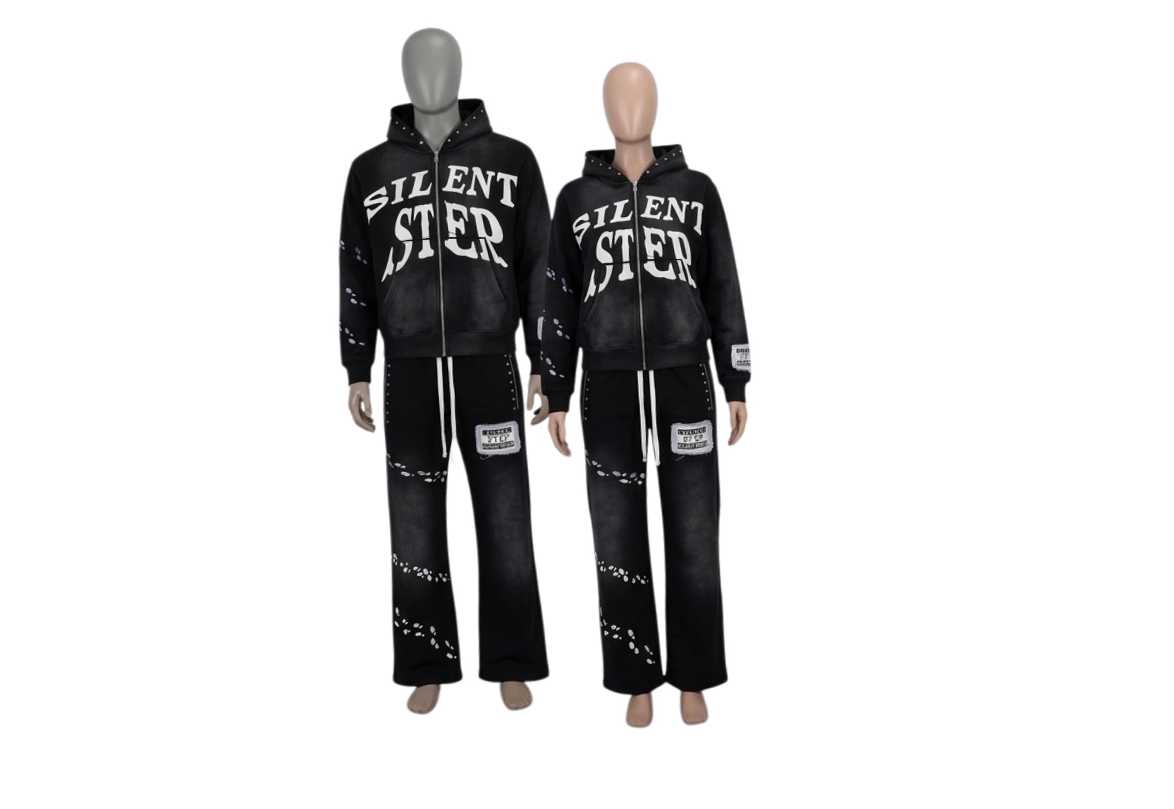 Two black hooded tracksuits displayed on mannequins, featuring the word 'SILENT STEP' in white across the chest and distressed white details on the pants, against a plain white background.