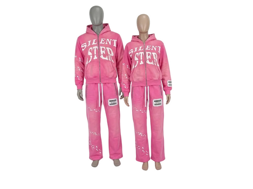 Two pink zip-up hooded sweatshirt and matching sweatpants sets displayed on mannequins against a plain white background. The larger set has 'SILENT STEP' printed